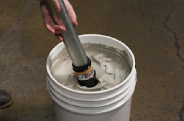 Loading a bulk caulking gun directly from the pail.