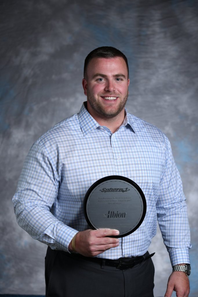 Dean Hammel holding the Sphere1 Opal Echelon Award